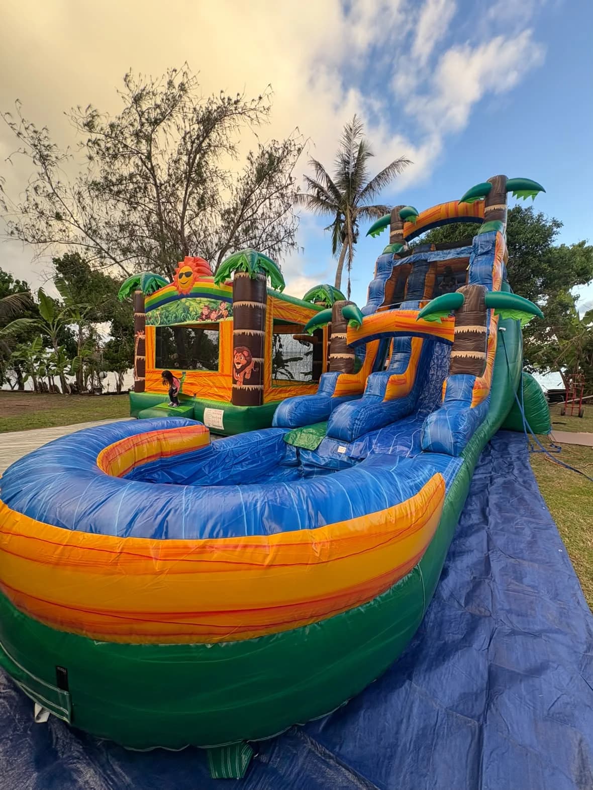 Tropical Waterslide and Tropical Bounce House rental setup in Guam